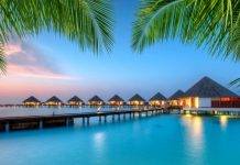 Luxury Escapes Gutscheincode: 10% Rabatt auf deinen nächsten Traumurlaub sichern Luxus Resort mit Meer und Palmen